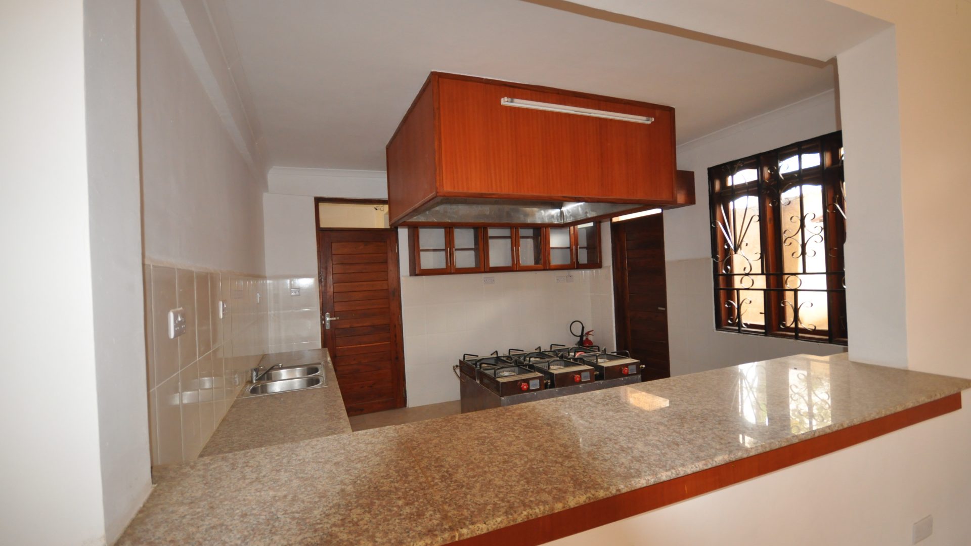A Kitchen of the Commercial Building for Sale in Sakina, Arusha by Tanganyika Estate Agents