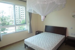 A Bedroom of the Two Bedroom Furnished Apartments in Upanga, Dar es Salaam by Tanganyika Estate Agents