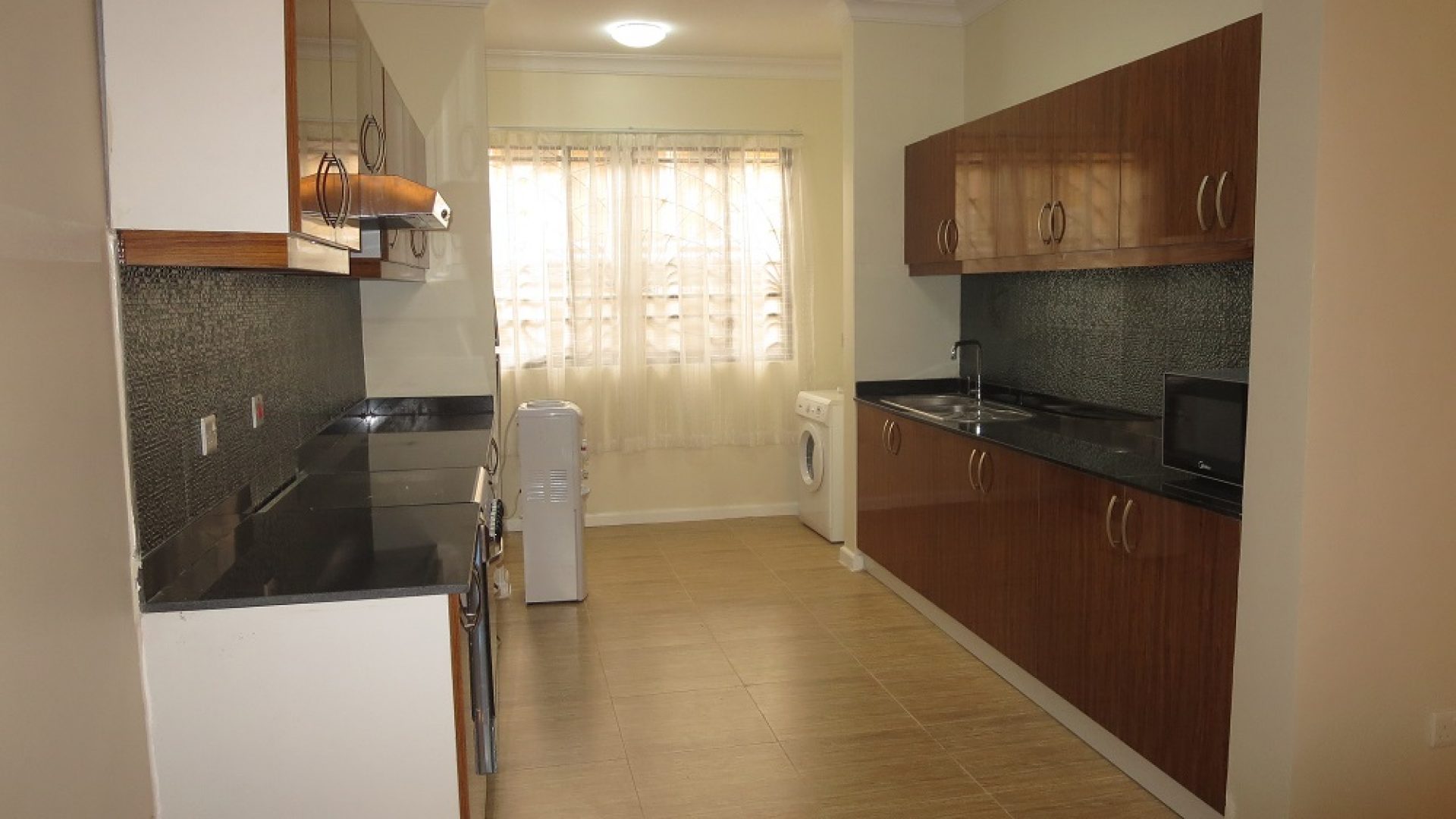 A Kitchen in the 2 Bedroom Furnished Apartments in Masaki by Tanganyika Estate Agents