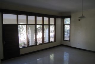 Living Room with Veranda Outside of the Four Bedroom Home for Rent near Njiro Shopping Compex by Tanganyika Estate Agents