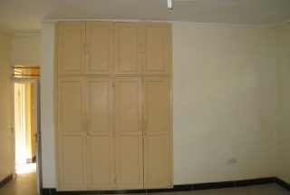 Walk in Closet of a Bedroom of the Four Bedroom Home for Rent near Njiro Shopping Compex by Tanganyika Estate Agents