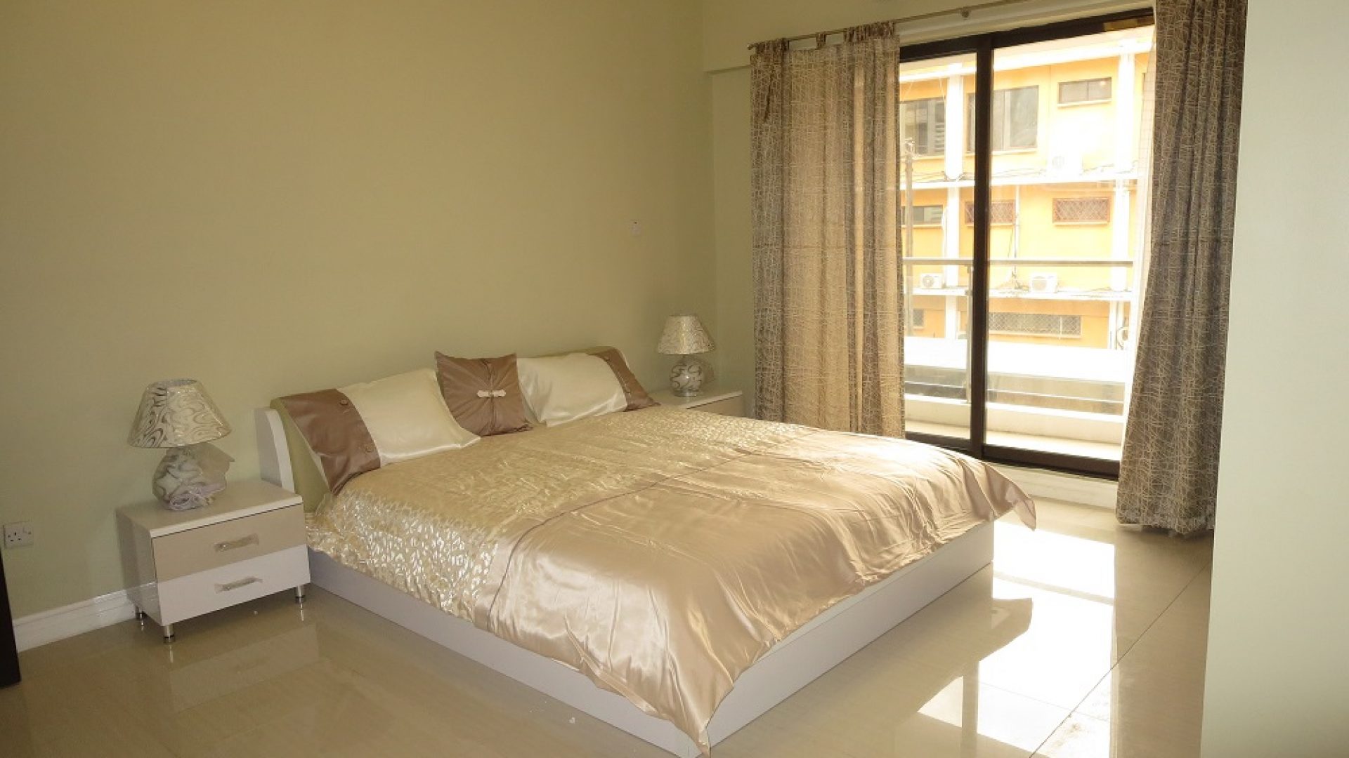 A Bedroom in the 2 Bedroom Furnished Apartments in Masaki by Tanganyika Estate Agents
