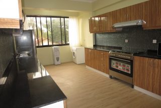 A Kitchen in the 2 Bedroom Furnished Apartments in Masaki by Tanganyika Estate Agents
