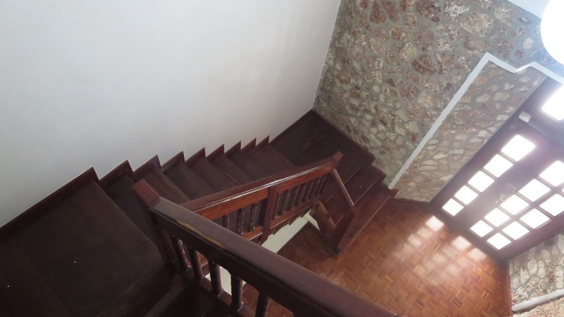 A staircase of the Four Bedroom Home in Masaki, Dar es Salaam by Tanganyika Estate Agents