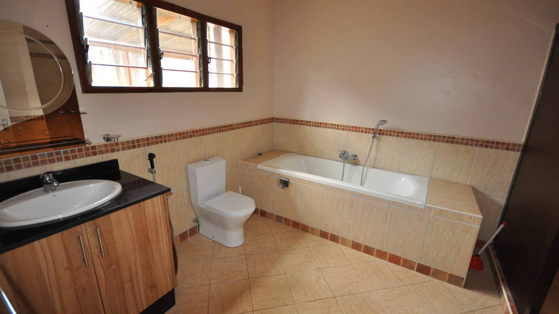 A Bathroom of the Four Bedroom Furnished House in Olorien by Tanganyika Estate Agents