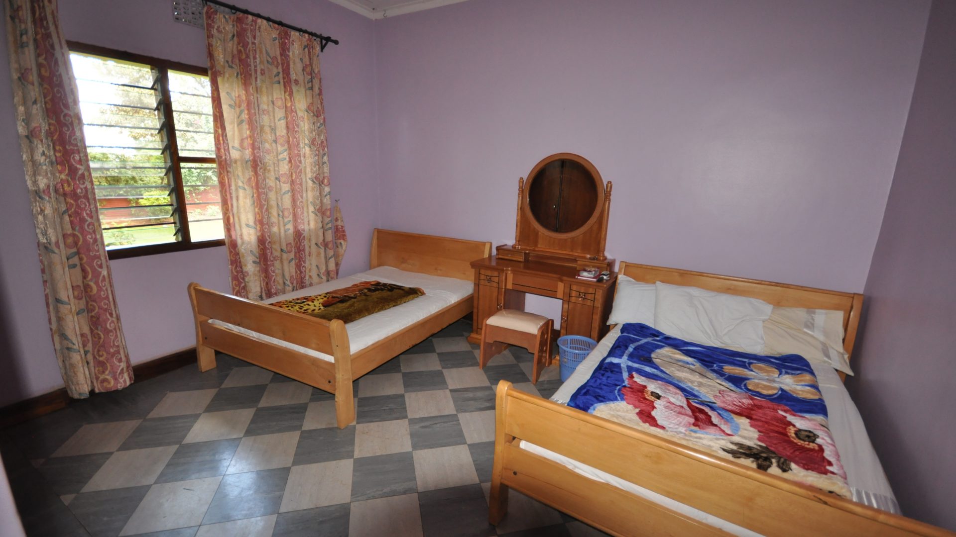 The Bedroom of the Four Bedroom Furnished House in Olorien by Tanganyika Estate Agents
