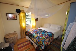 A Bedroom of the 7 Bedroom Home for Sale in Mateves, Arusha by Tanganyika Estate Agents