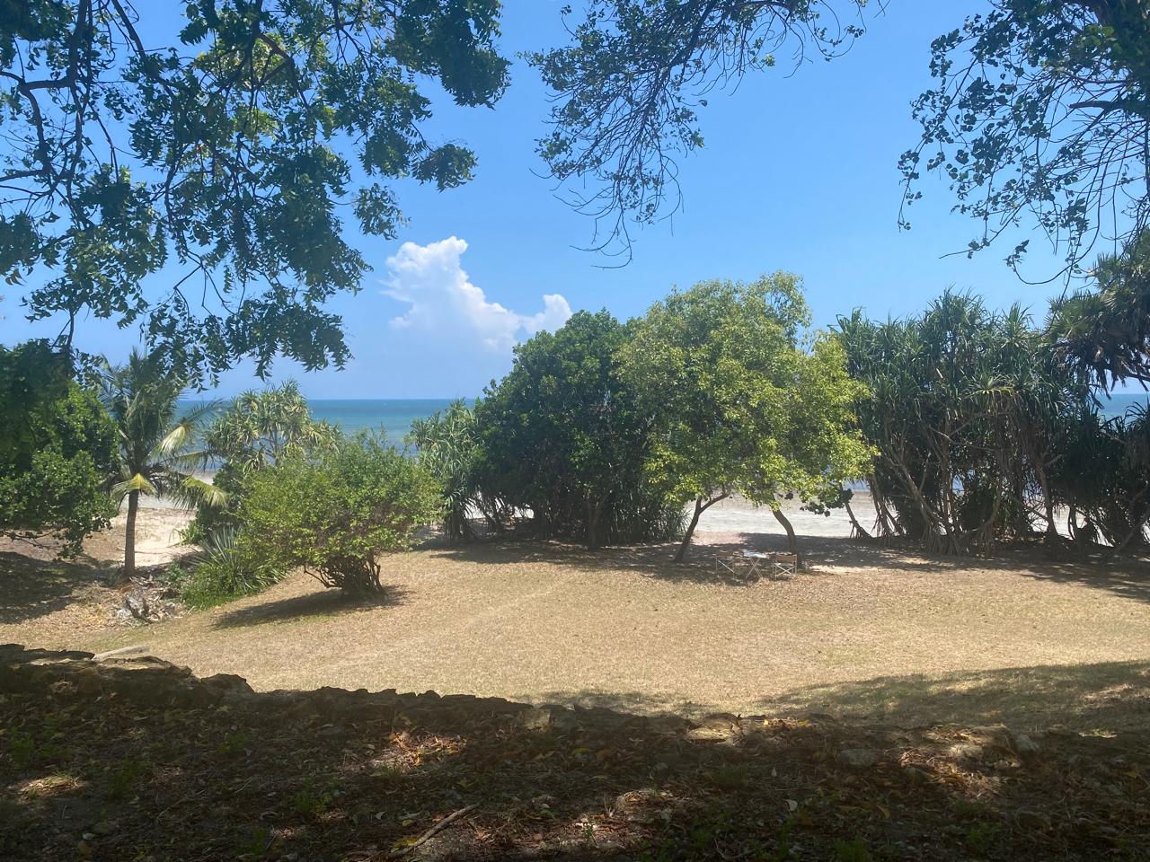 Amboni –  Secluded private beachfront plot  –   small bungalow with ample space for a house